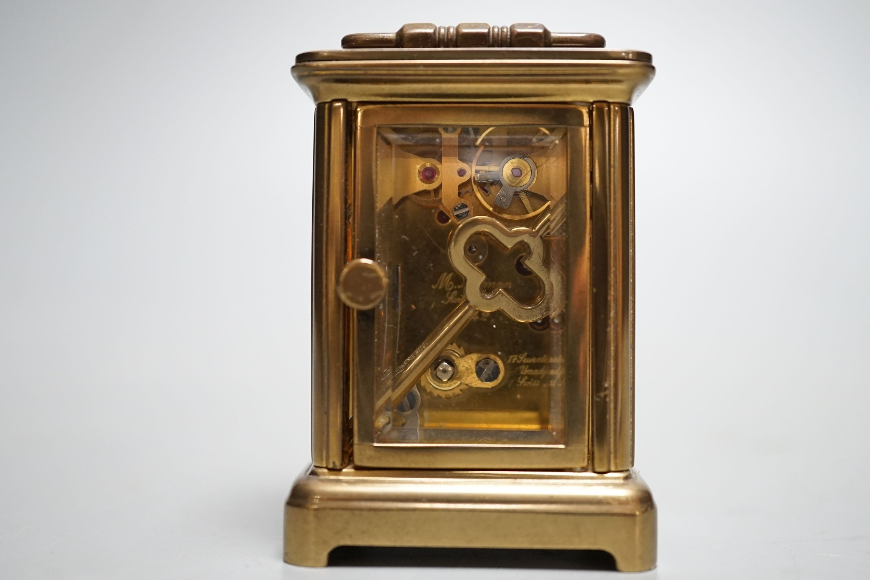 A Mathew Norman miniature brass carriage timepiece, 6cms high.